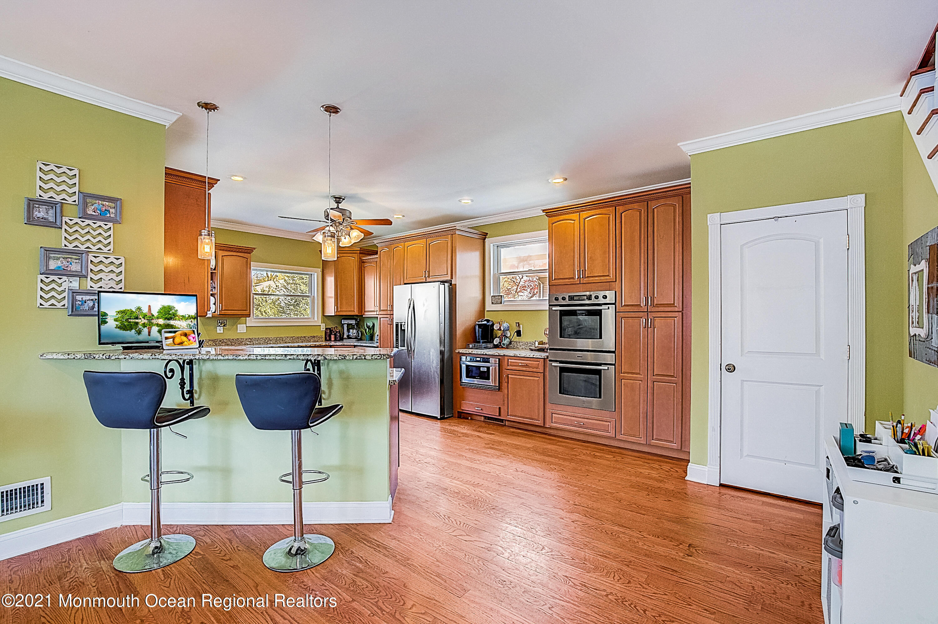 286 Main Street Middletown, NJ 07758 - Photo 18 of 69 a living room with kitchen island furniture and a kitchen view