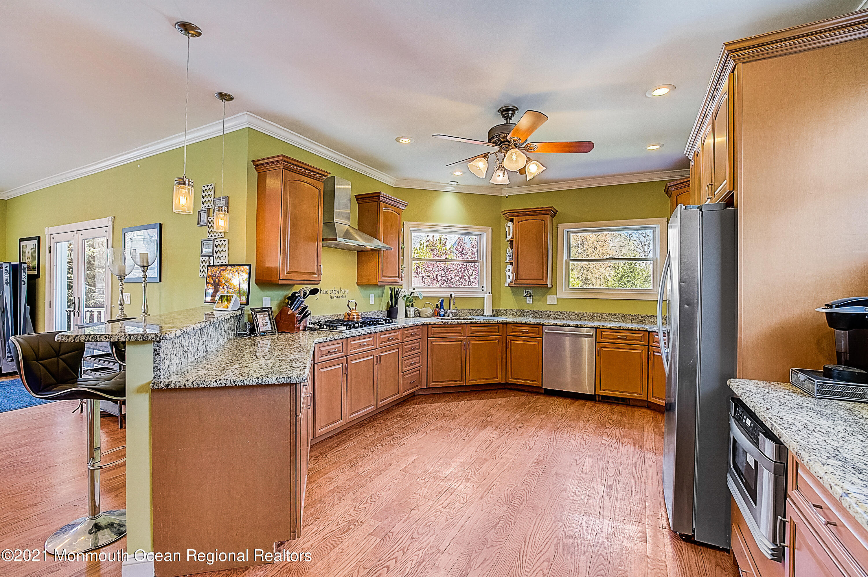 286 Main Street Middletown, NJ 07758 - Photo 20 of 69 a kitchen with stainless steel appliances granite countertop wooden floors and granite counter tops