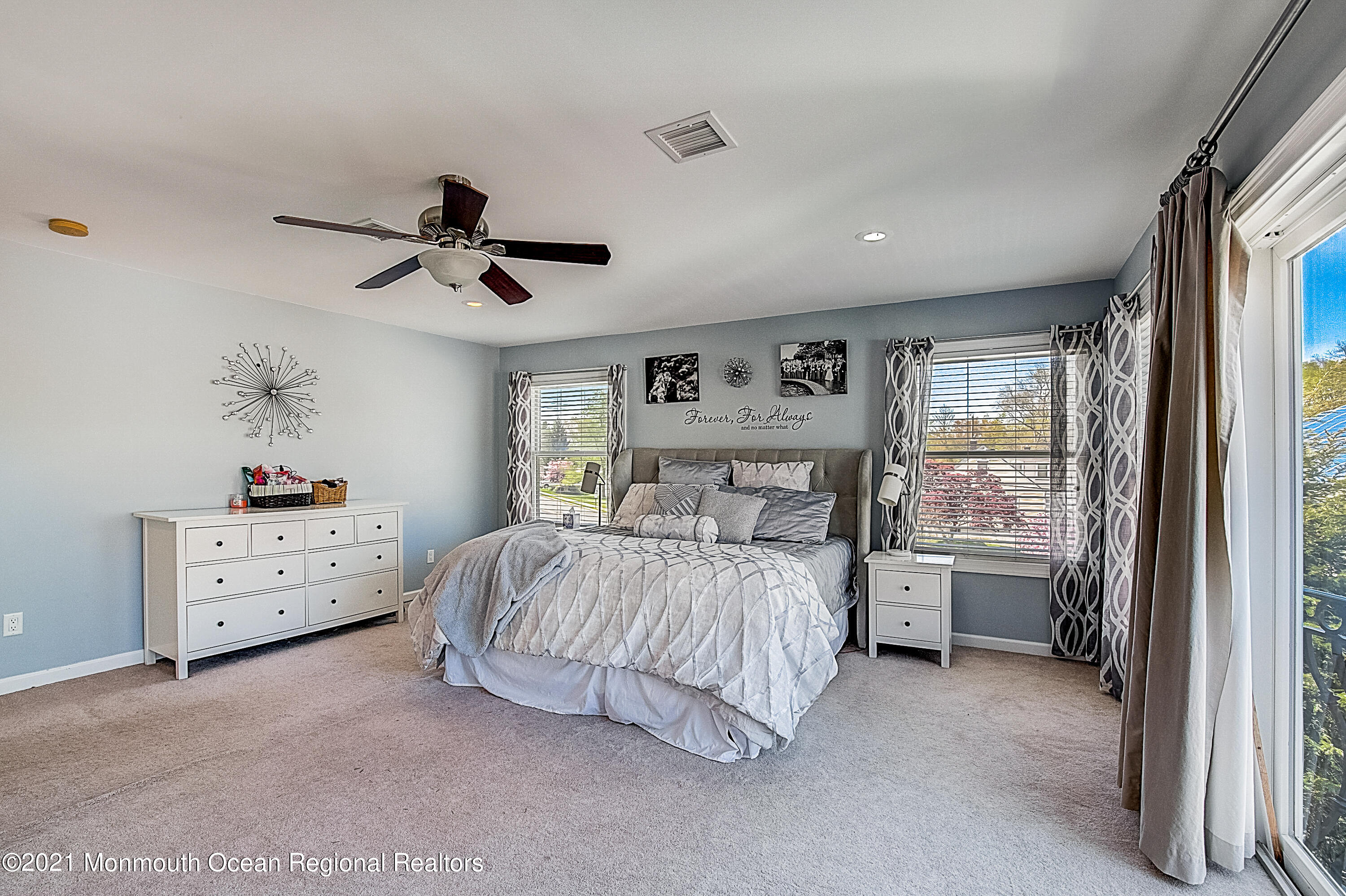 286 Main Street Middletown, NJ 07758 - Photo 36 of 69 a bedroom with a bed and a chandelier