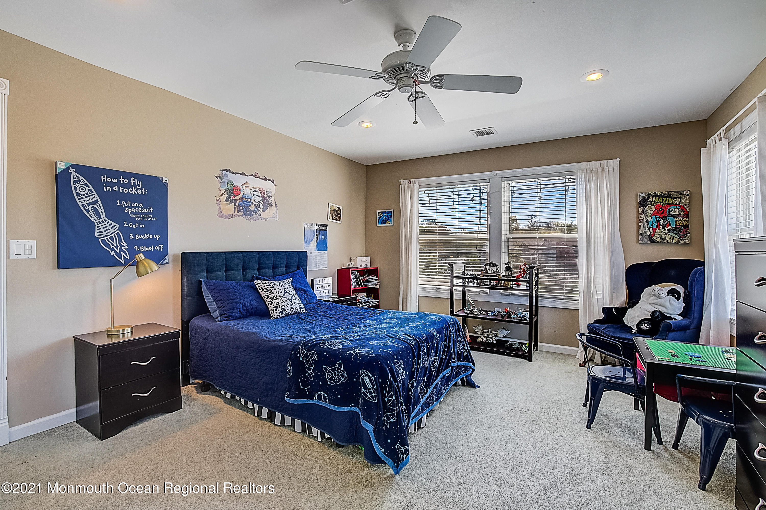 286 Main Street Middletown, NJ 07758 - Photo 44 of 69 a bedroom with a bed and a table in it