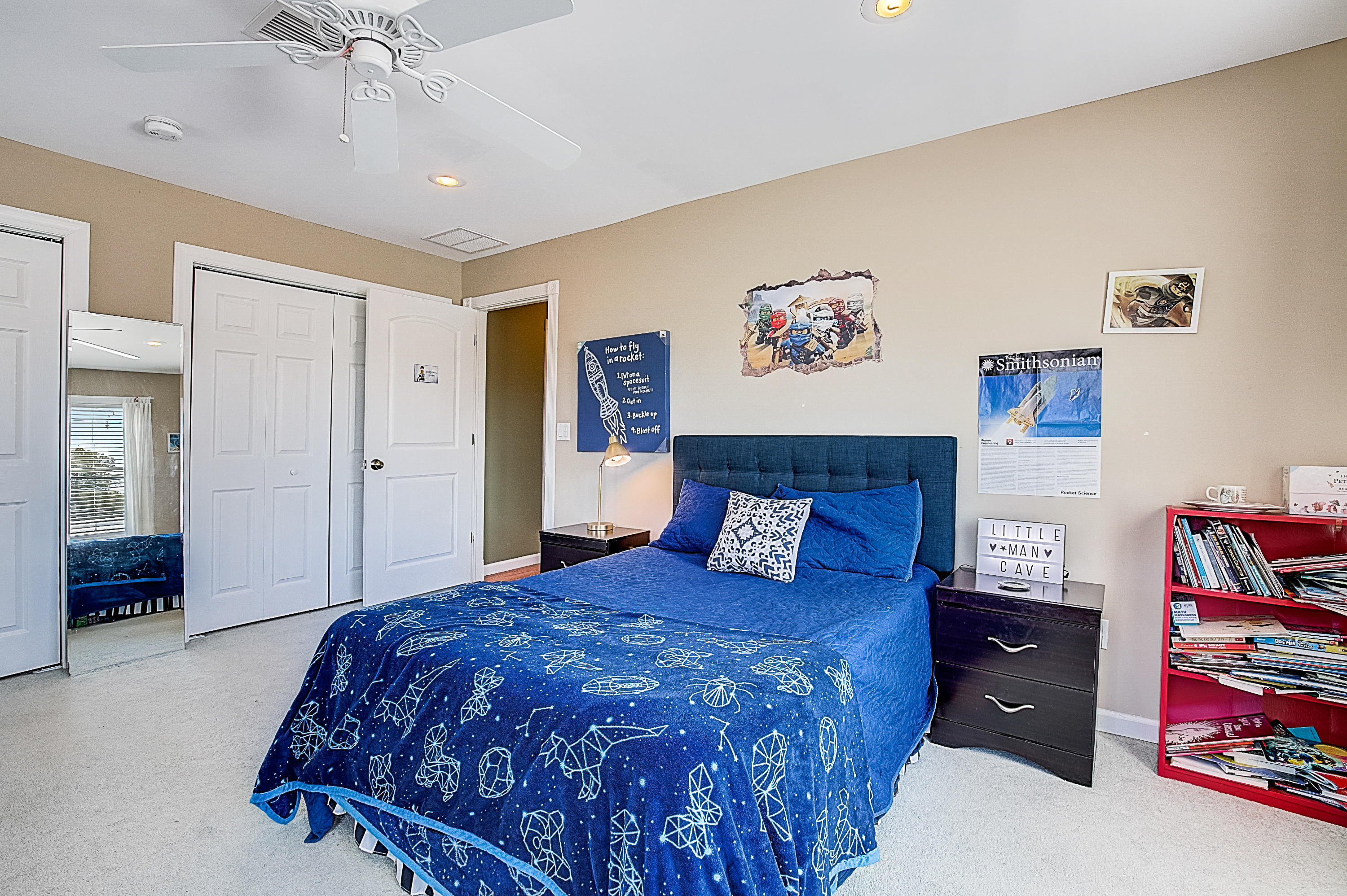 286 Main Street Middletown, NJ 07758 - Photo 45 of 69 a spacious bedroom with a bed and a chandelier