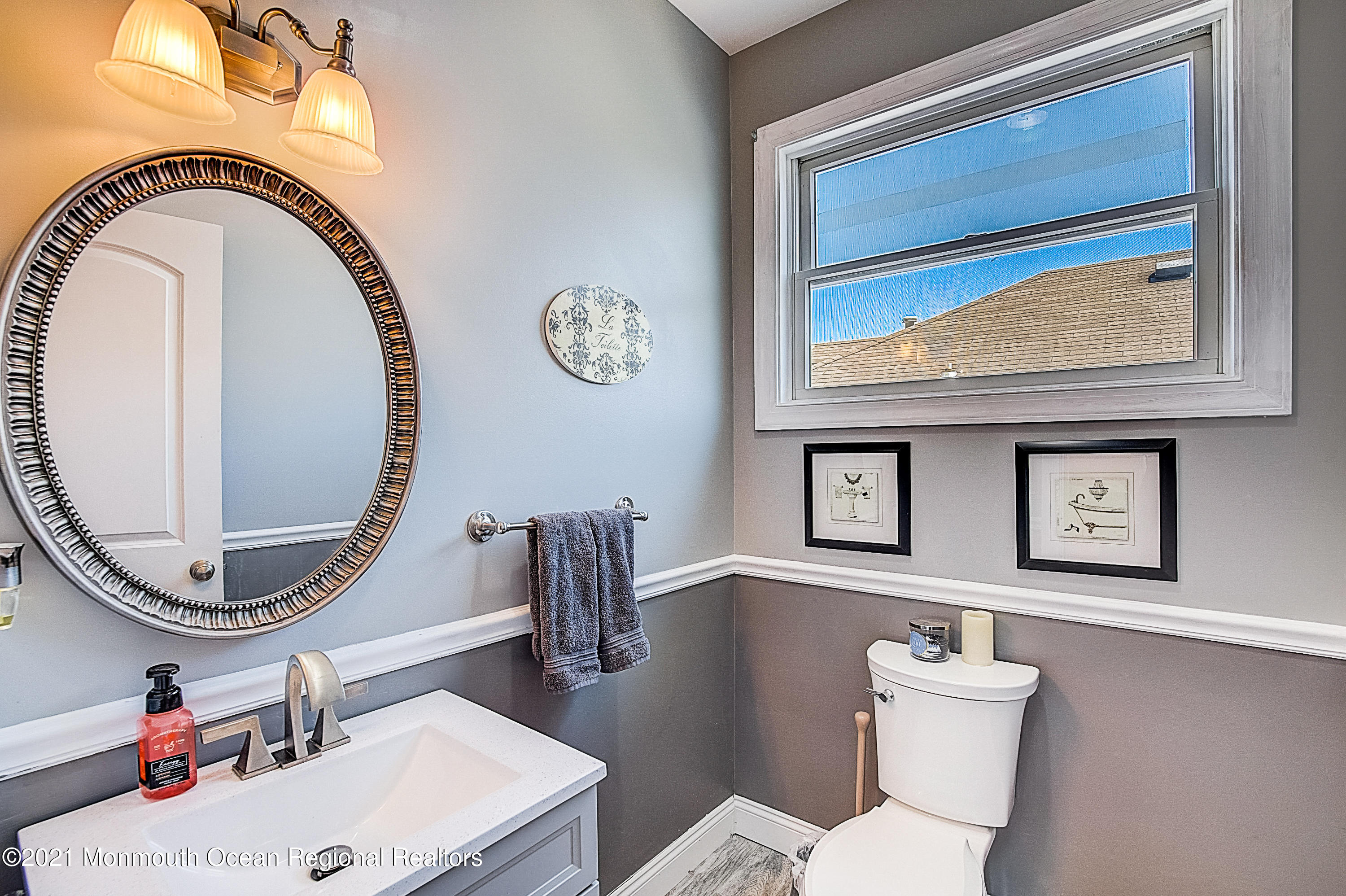 286 Main Street Middletown, NJ 07758 - Photo 51 of 69 a bathroom with a toilet a sink and a mirror
