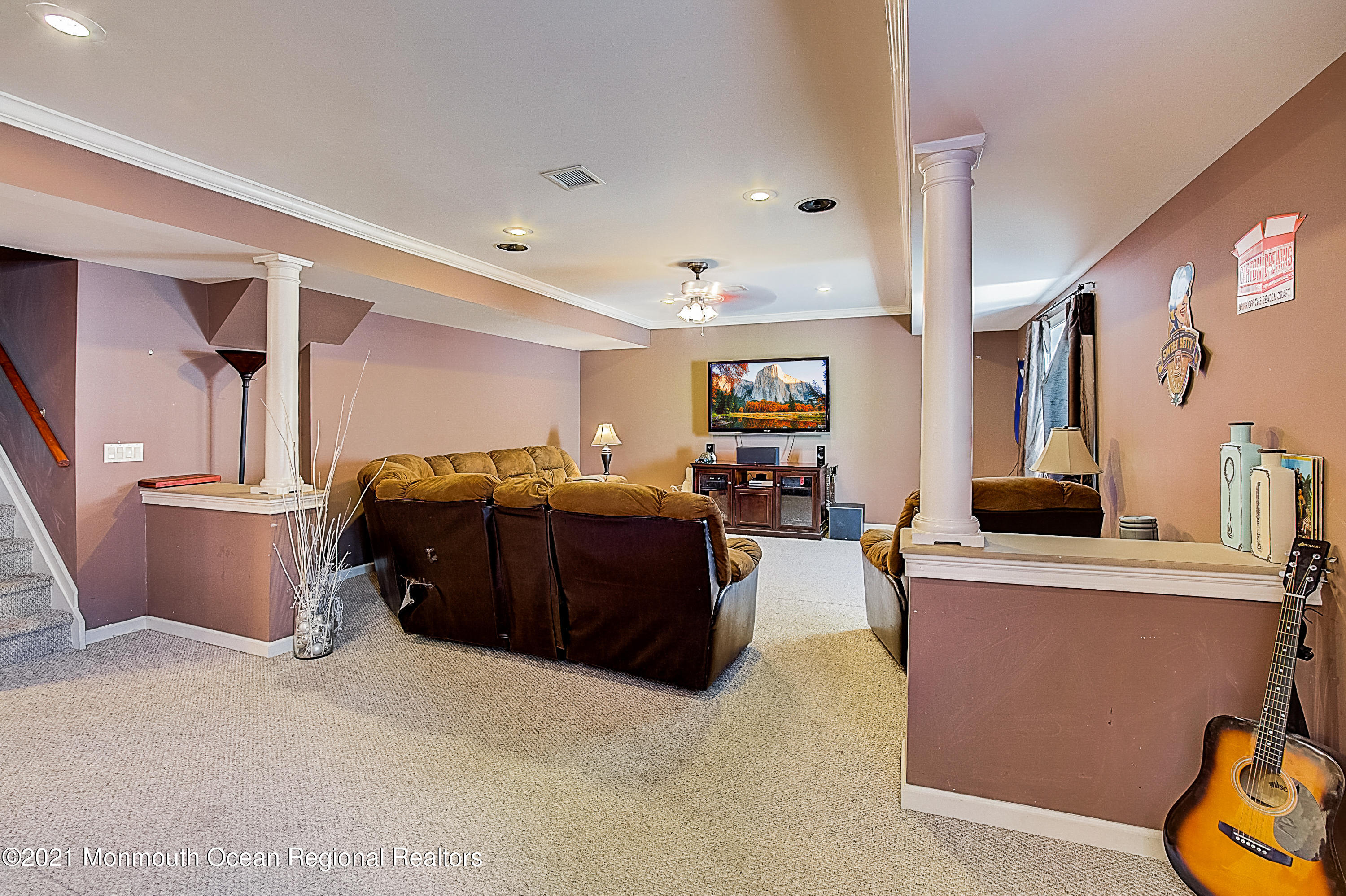 286 Main Street Middletown, NJ 07758 - Photo 56 of 69 a living room with furniture and a flat screen tv