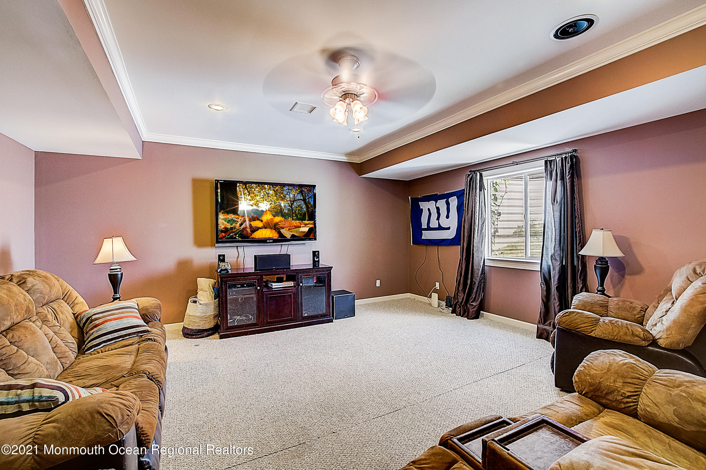 286 Main Street Middletown, NJ 07758 - Photo 60 of 69 a bedroom with furniture and a chandelier