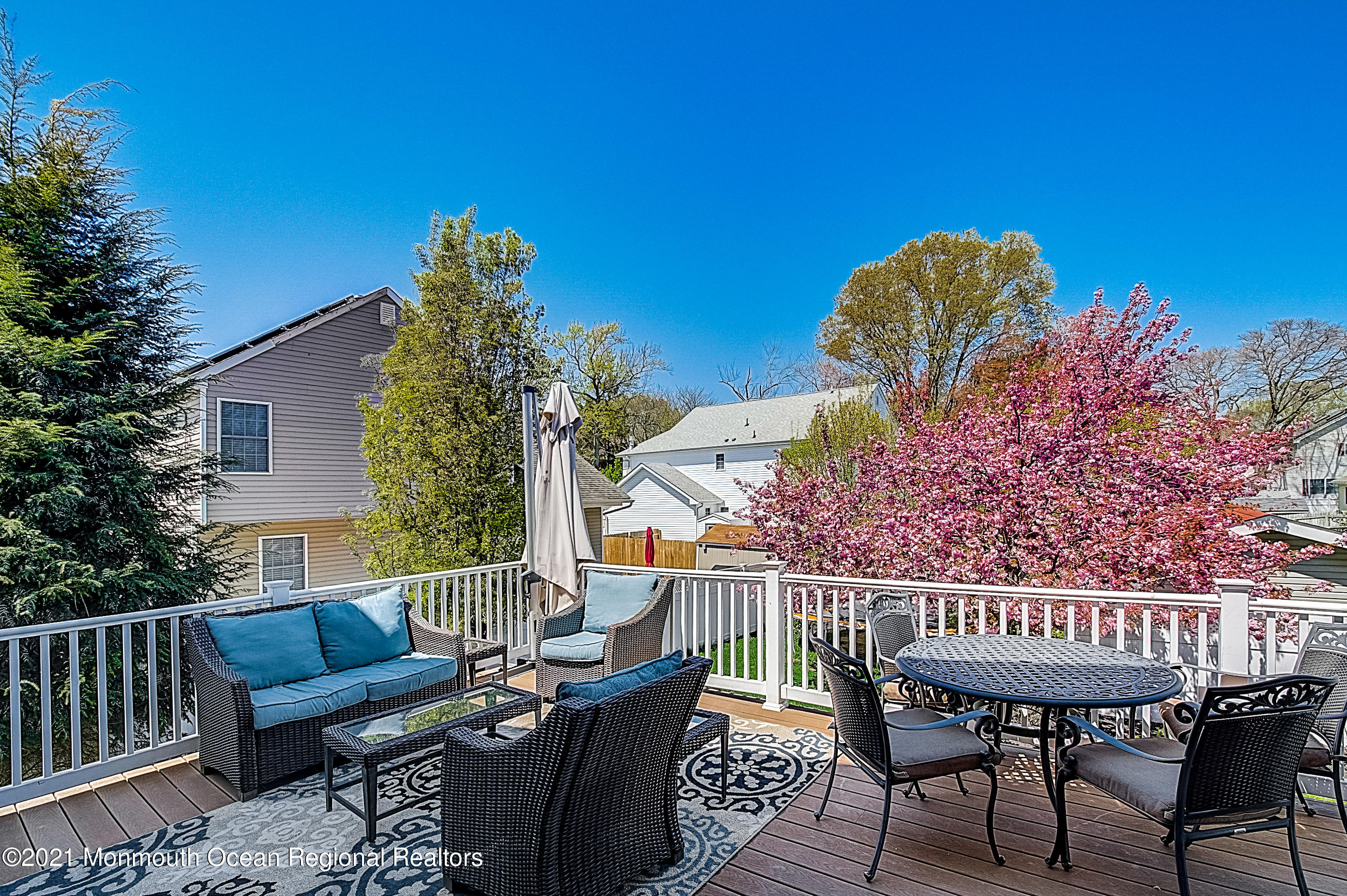 286 Main Street Middletown, NJ 07758 - Photo 64 of 69 a view of a chairs and table in the back yard of the house