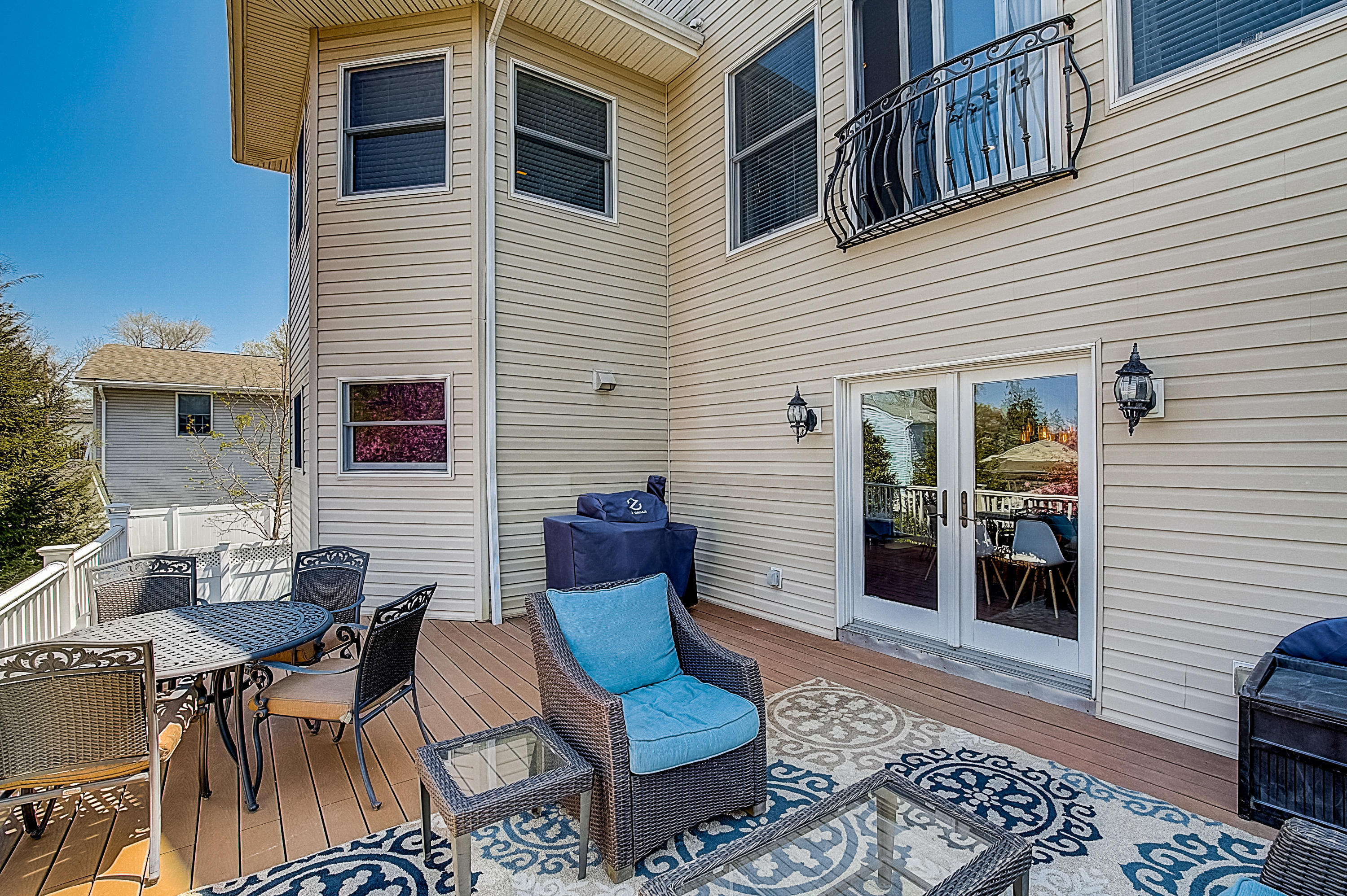 286 Main Street Middletown, NJ 07758 - Photo 66 of 69 a view of a patio with couches table and chairs and potted plants