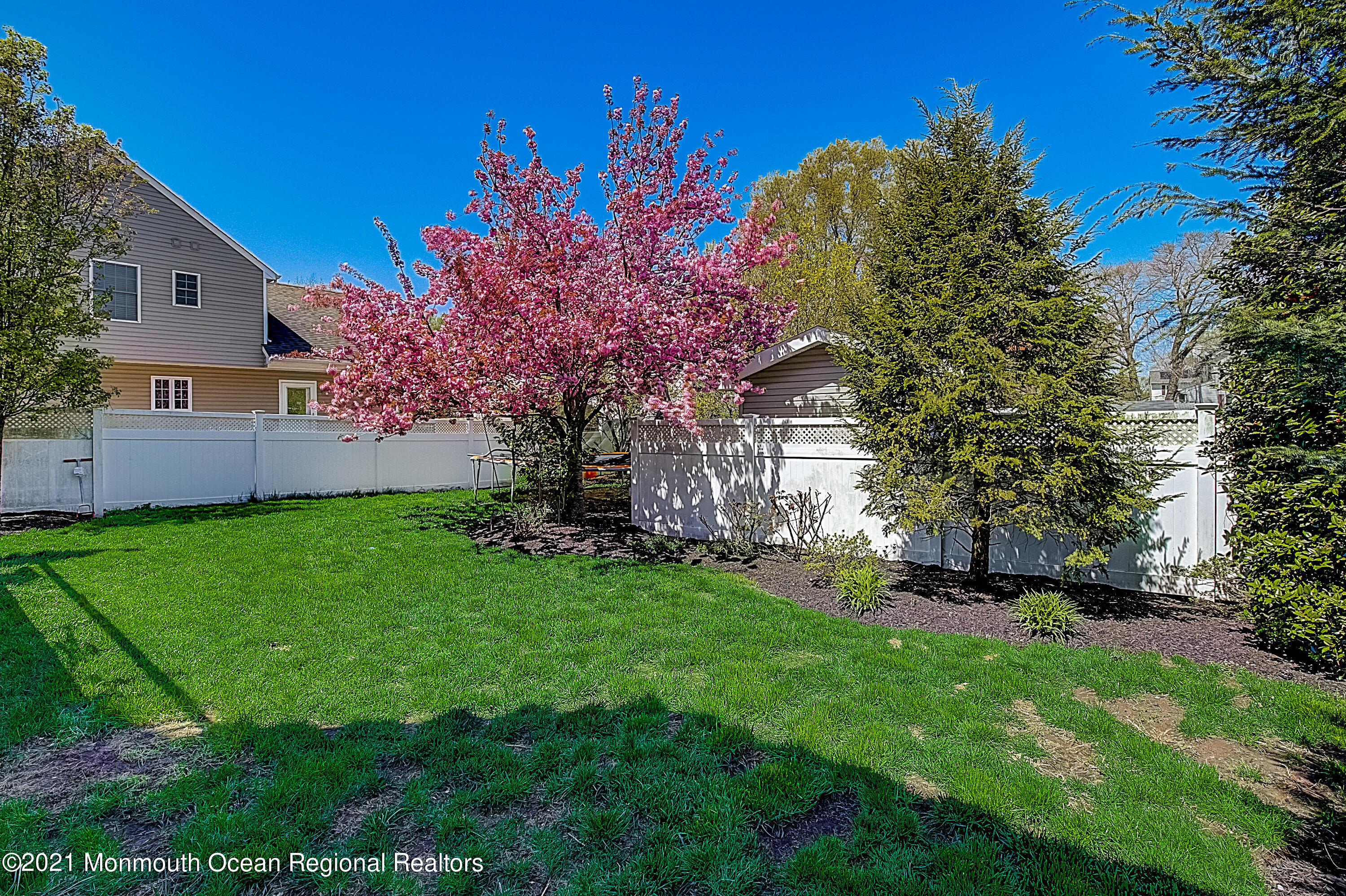 286 Main Street Middletown, NJ 07758 - Photo 68 of 69 a front view of a house with a garden