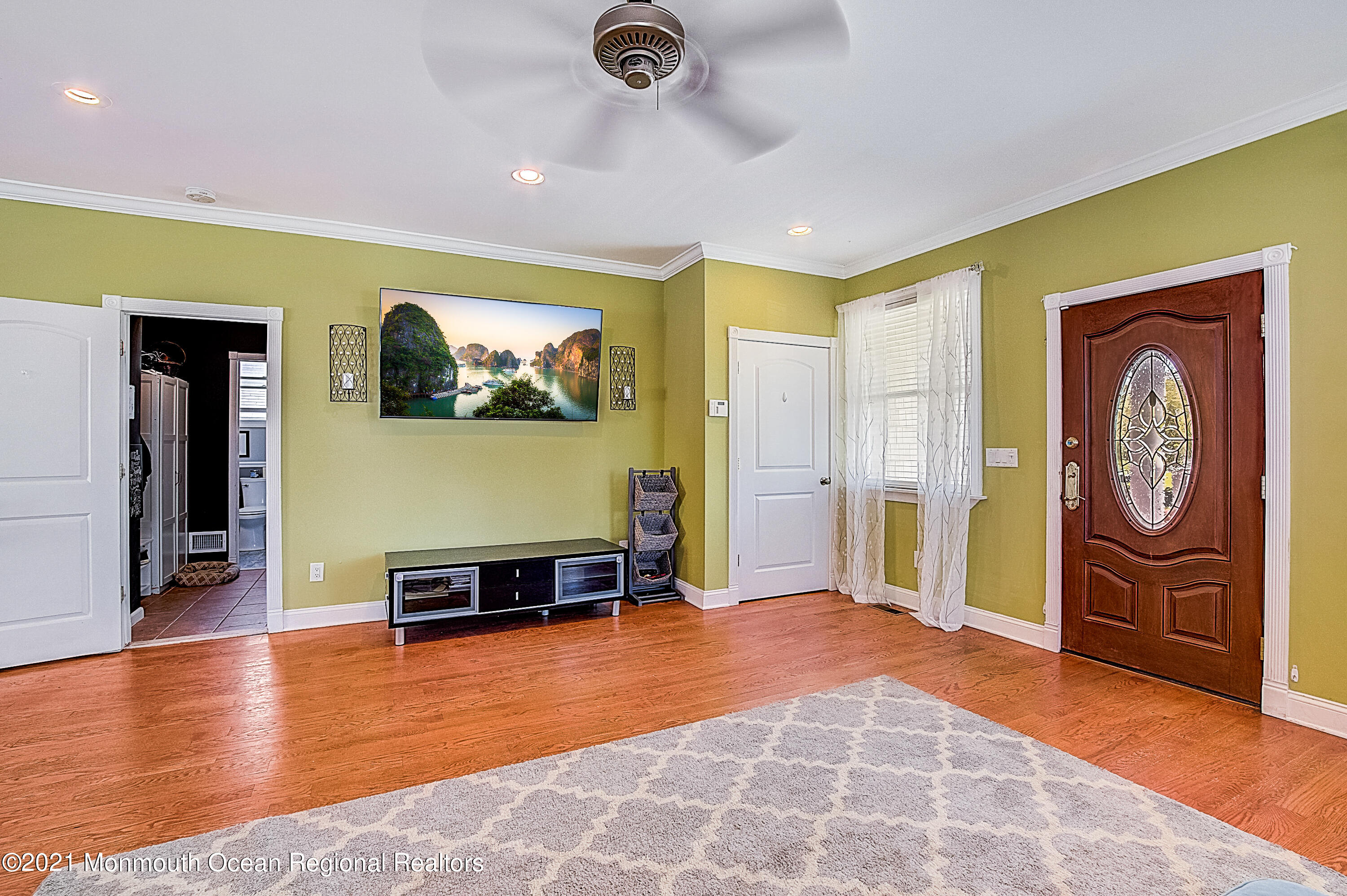286 Main Street Middletown, NJ 07758 - Photo 8 of 69 a view of a livingroom with furniture a flat screen tv and a chandelier