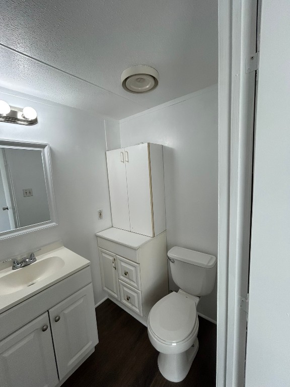 1406 East Wallisville Road Highlands, TX 77562 - Photo 11 of 26 a bathroom with a toilet sink vanity and mirror