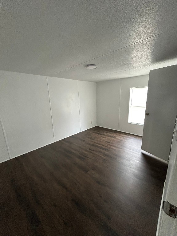 1406 East Wallisville Road Highlands, TX 77562 - Photo 23 of 26 an empty room with wooden floor and windows