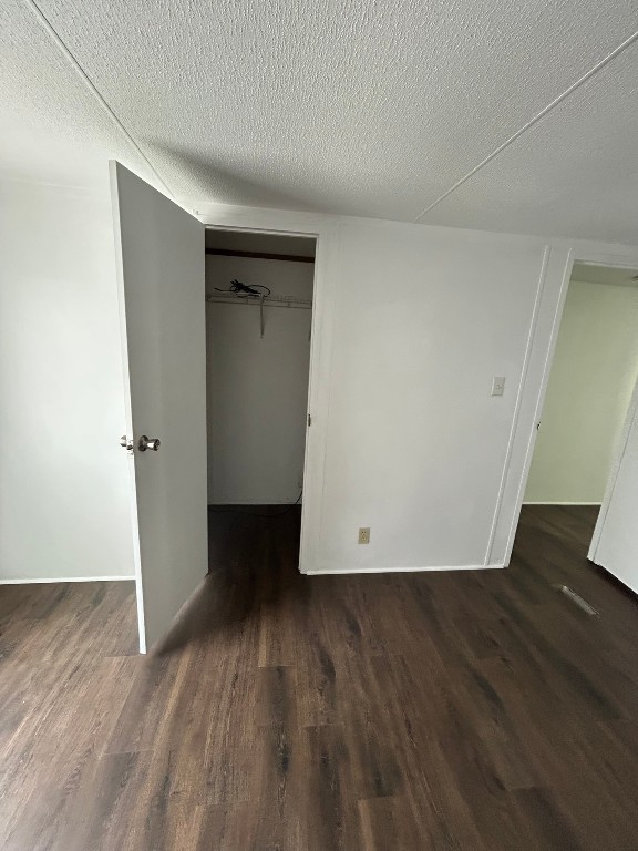 1406 East Wallisville Road Highlands, TX 77562 - Photo 24 of 26 an empty room with wooden floor and closet
