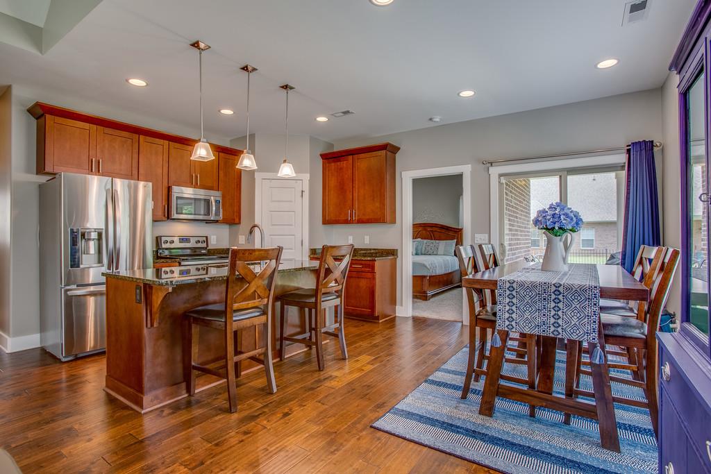 5012 Geranium Drive Spring Hill, TN 37174 - Photo 11 of 26 a view of a dining room with furniture window and wooden floor