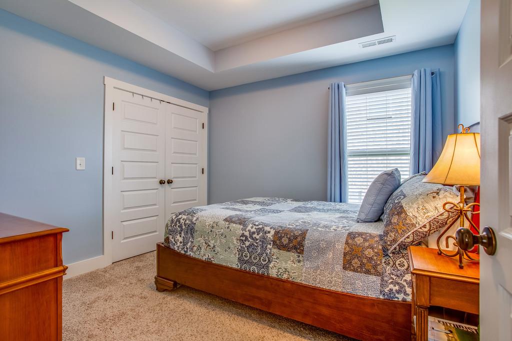 5012 Geranium Drive Spring Hill, TN 37174 - Photo 17 of 26 a bedroom with a bed and a window