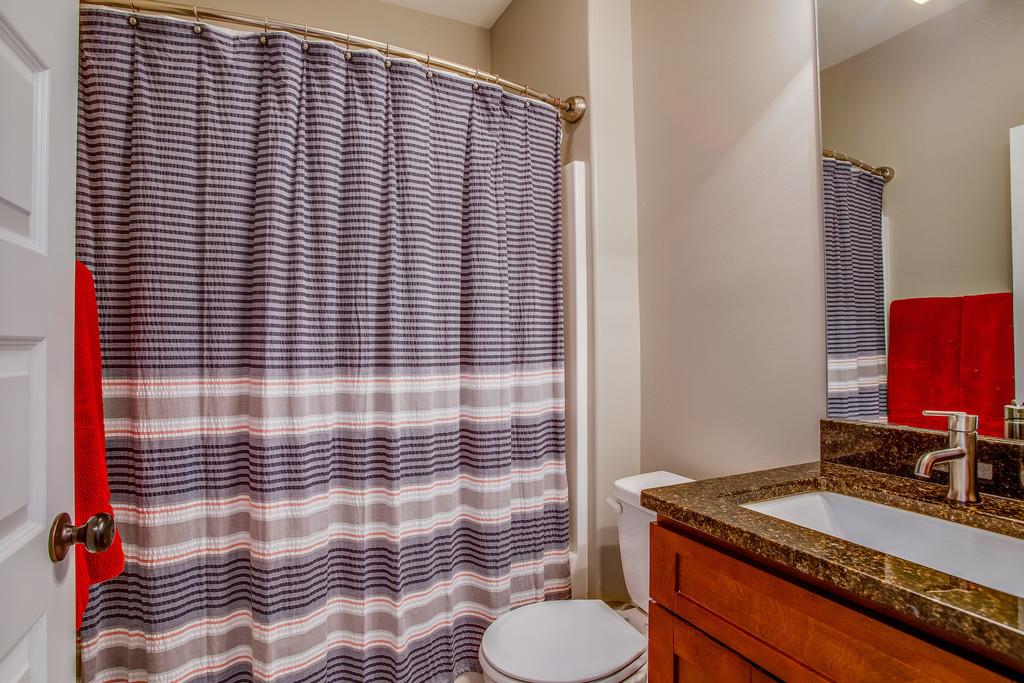5012 Geranium Drive Spring Hill, TN 37174 - Photo 19 of 26 a bathroom with a granite countertop sink toilet and mirror