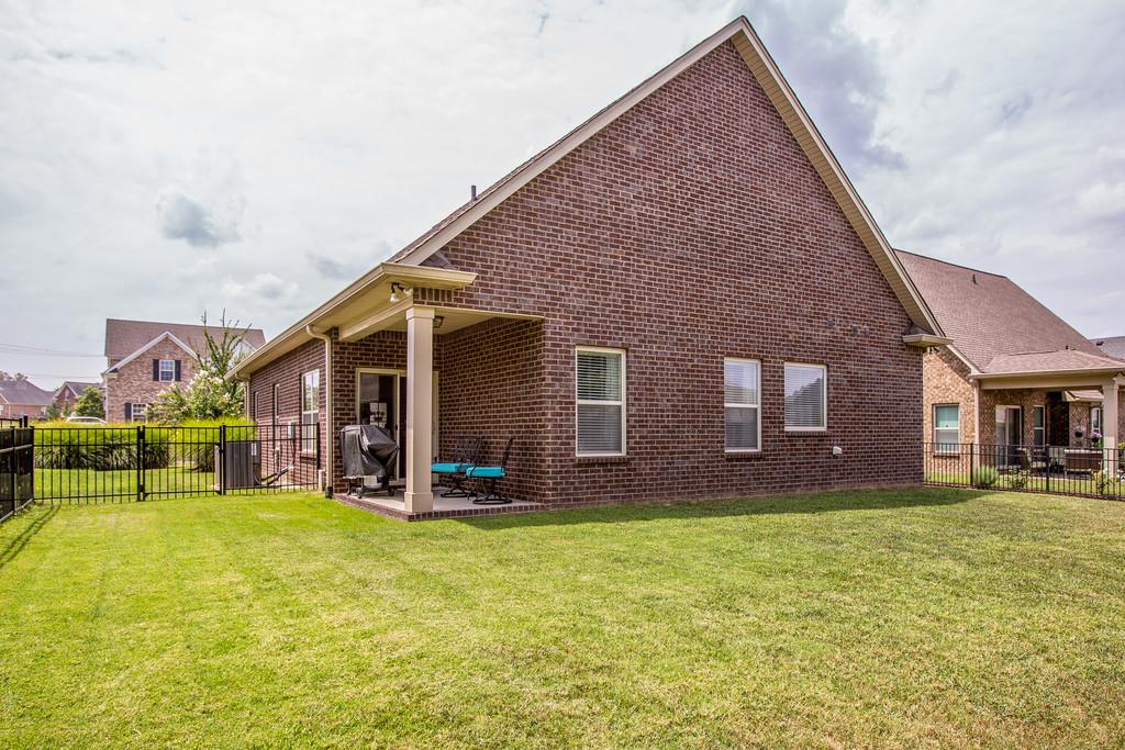5012 Geranium Drive Spring Hill, TN 37174 - Photo 23 of 26 a view of a house with a yard and large tree