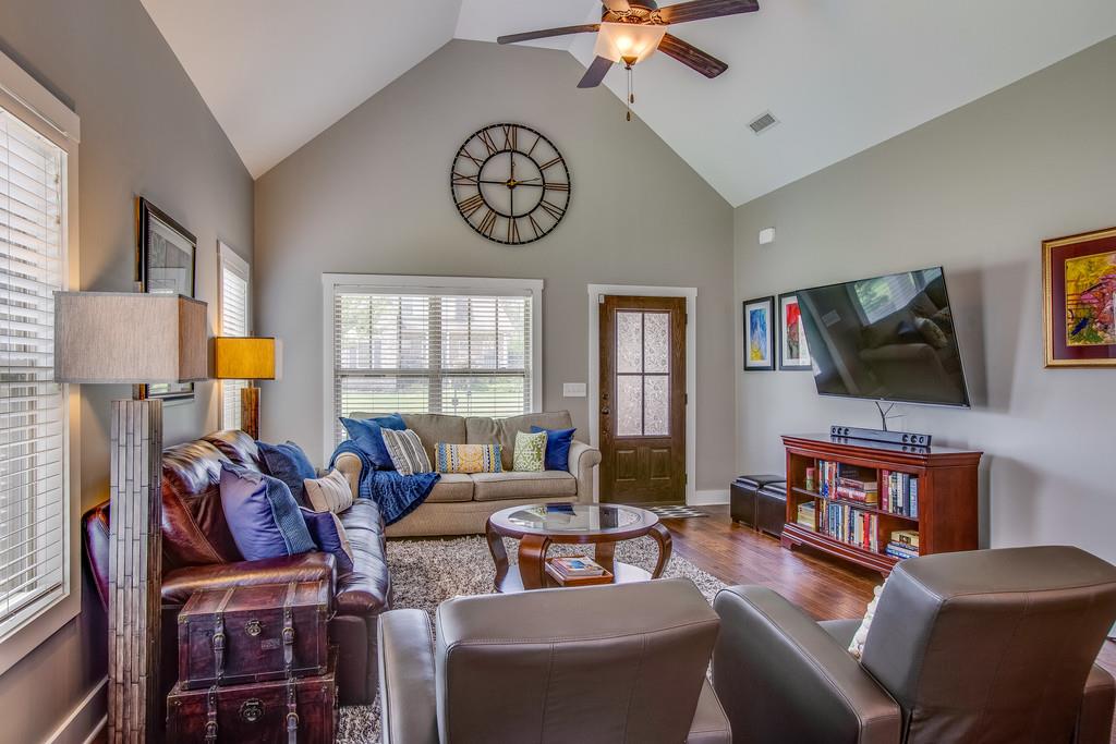 5012 Geranium Drive Spring Hill, TN 37174 - Photo 5 of 26 a living room with furniture a flat screen tv and a window