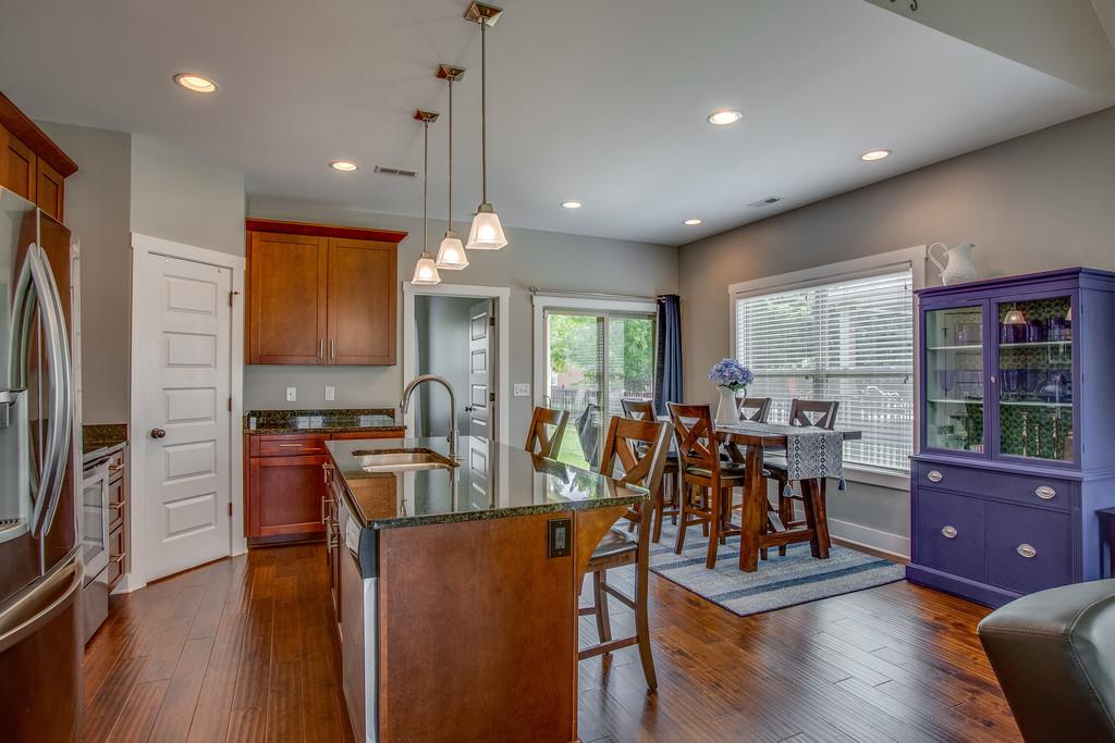 5012 Geranium Drive Spring Hill, TN 37174 - Photo 6 of 26 a view of a dining room with furniture window and wooden floor