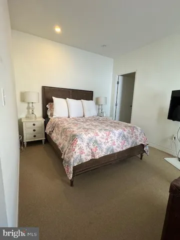 a bed room with a bed and a couch