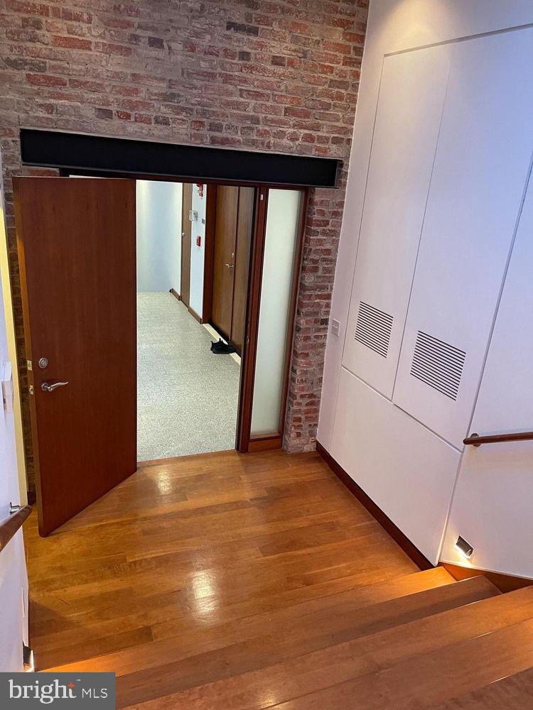 3336 Cady's Alley Northwest, Unit 201 Washington, DC 20007 - Photo 21 of 34 a view of a room with wooden floor