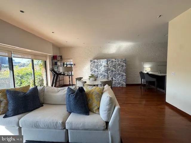 a kitchen with cabinets and wooden floor