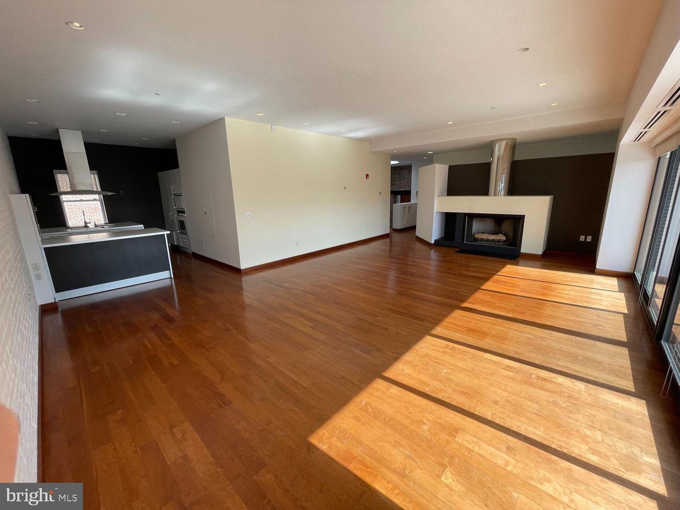 3336 Cady's Alley Northwest, Unit 201 Washington, DC 20007 - Photo 4 of 34 a view of kitchen with furniture and wooden floor