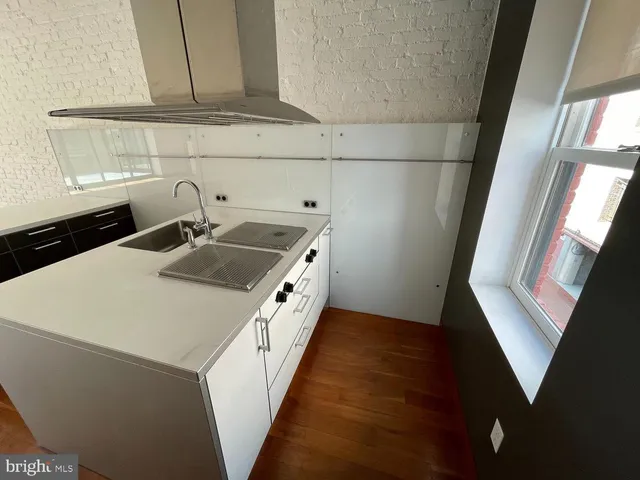 a kitchen with a refrigerator sink and microwave