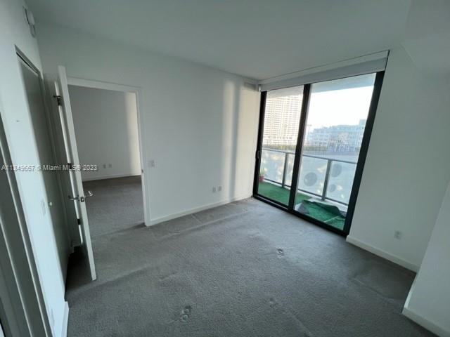 Edgewater Miami, FL 33137 - Photo 18 of 65 an empty room with windows