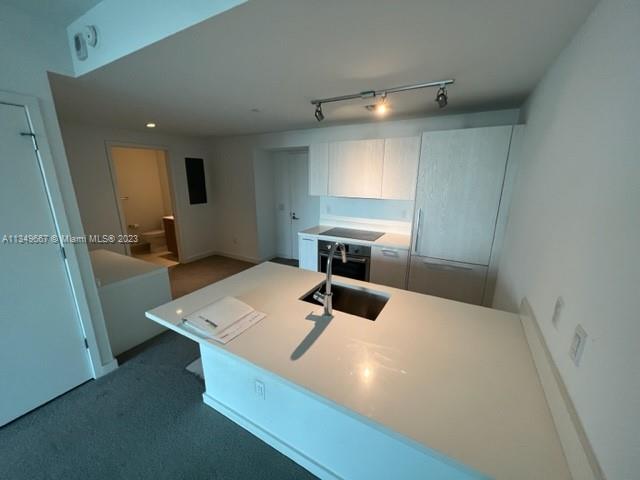 Edgewater Miami, FL 33137 - Photo 19 of 65 a room with a bed and a table