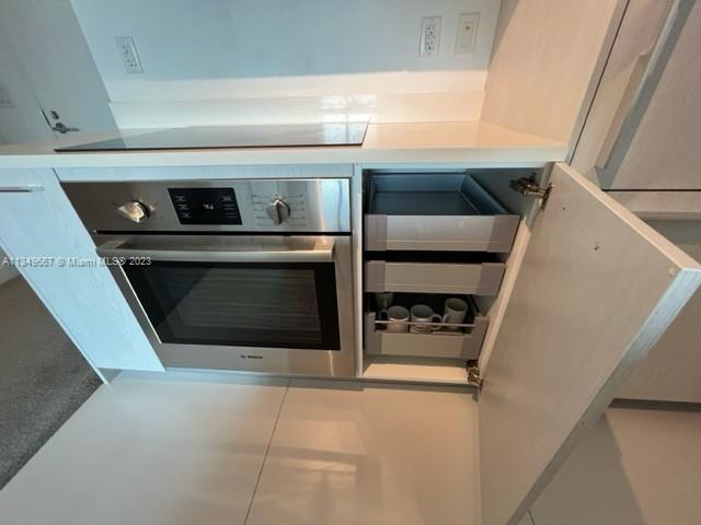 Edgewater Miami, FL 33137 - Photo 24 of 65 a stove top oven sitting inside of a kitchen