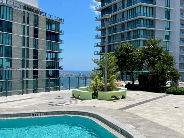 Edgewater Miami, FL 33137 - Photo 32 of 65 a view of tall building with a yard in front of it