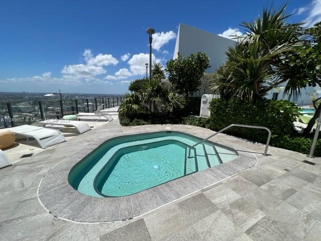 Edgewater Miami, FL 33137 - Photo 40 of 65 a view of a swimming pool with a yard
