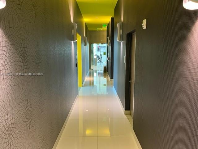 Edgewater Miami, FL 33137 - Photo 44 of 65 a view of a hallway with a glass door