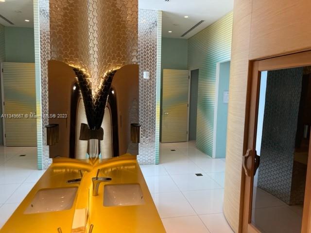 Edgewater Miami, FL 33137 - Photo 45 of 65 a bathroom with a tub and shower