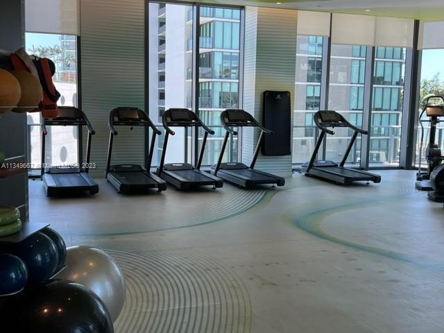 Edgewater Miami, FL 33137 - Photo 52 of 65 a view of a livingroom with furniture and a floor to ceiling window