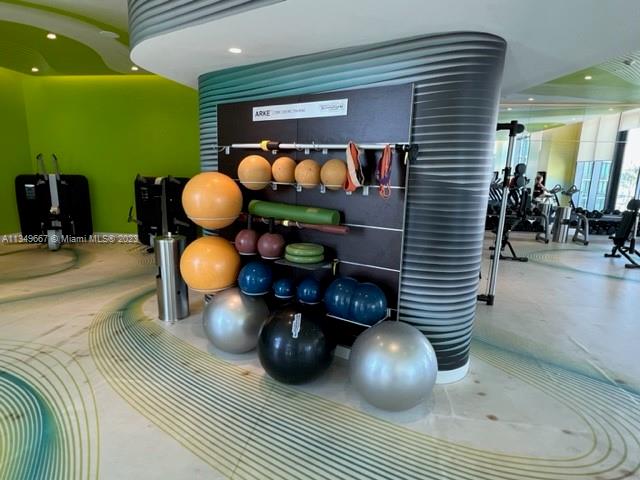 Edgewater Miami, FL 33137 - Photo 55 of 65 a room with wooden floor and furniture