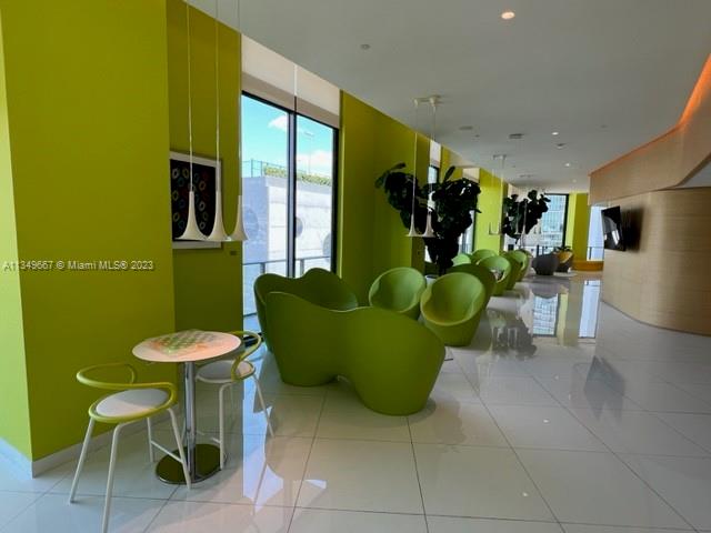 Edgewater Miami, FL 33137 - Photo 59 of 65 a view of a dining room with furniture and a large window