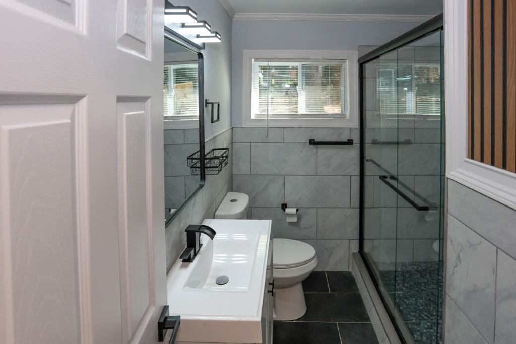 1508 Peachcrest Road Decatur, GA 30032 - Photo 13 of 26 a bathroom with a toilet and a shower