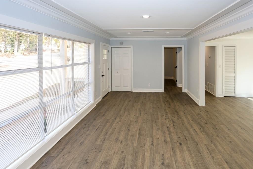 1508 Peachcrest Road Decatur, GA 30032 - Photo 5 of 26 a view of wooden floor in an empty room with a window