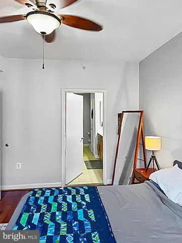 a bedroom with a bed and a rug