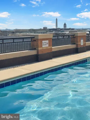 a view of a swimming pool with a lounge chair
