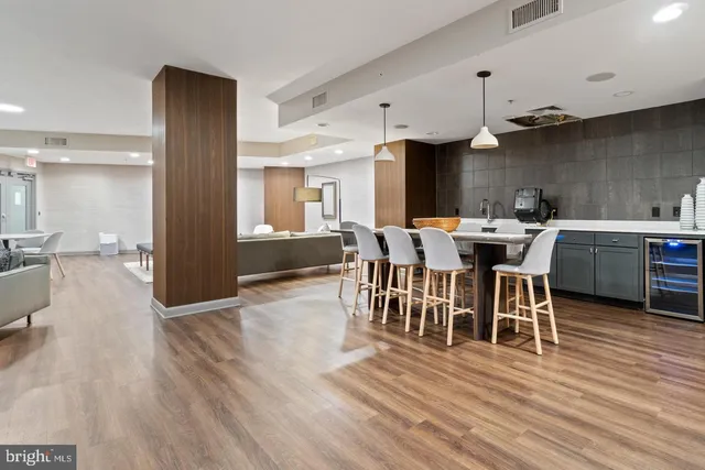 a view of a dining room with furniture and wooden floor
