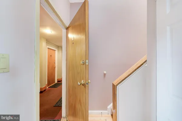 a view of a hallway with a door