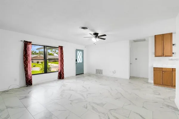 a view of an empty room with a window