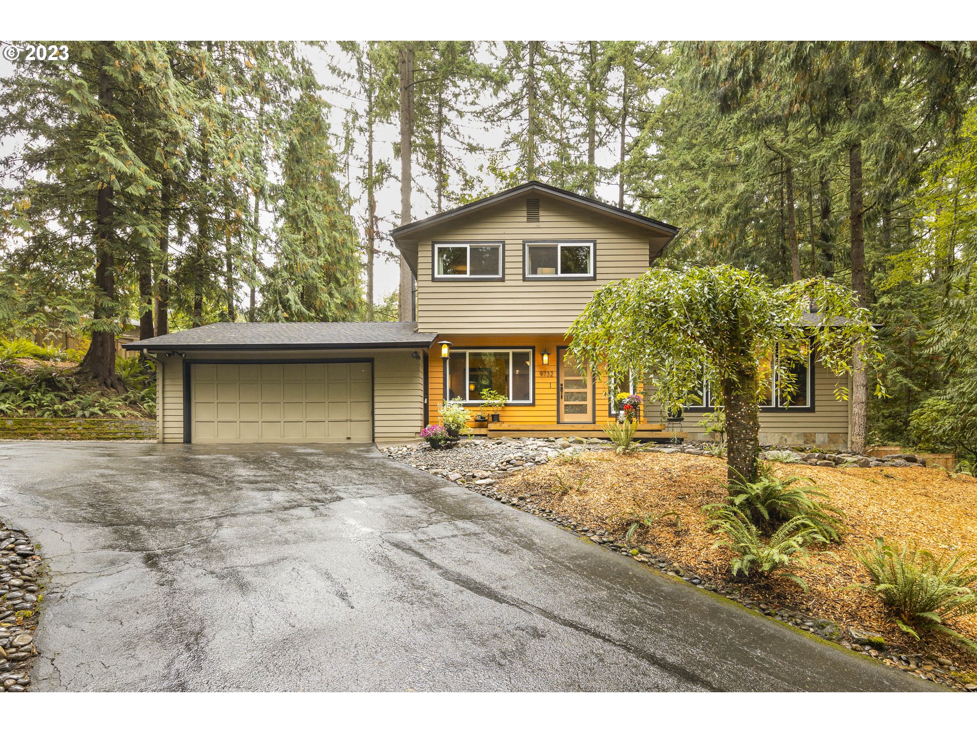 9732 Southwest 18th Place Portland, OR 97219 - Photo 1 of 45 a view of a house with a yard