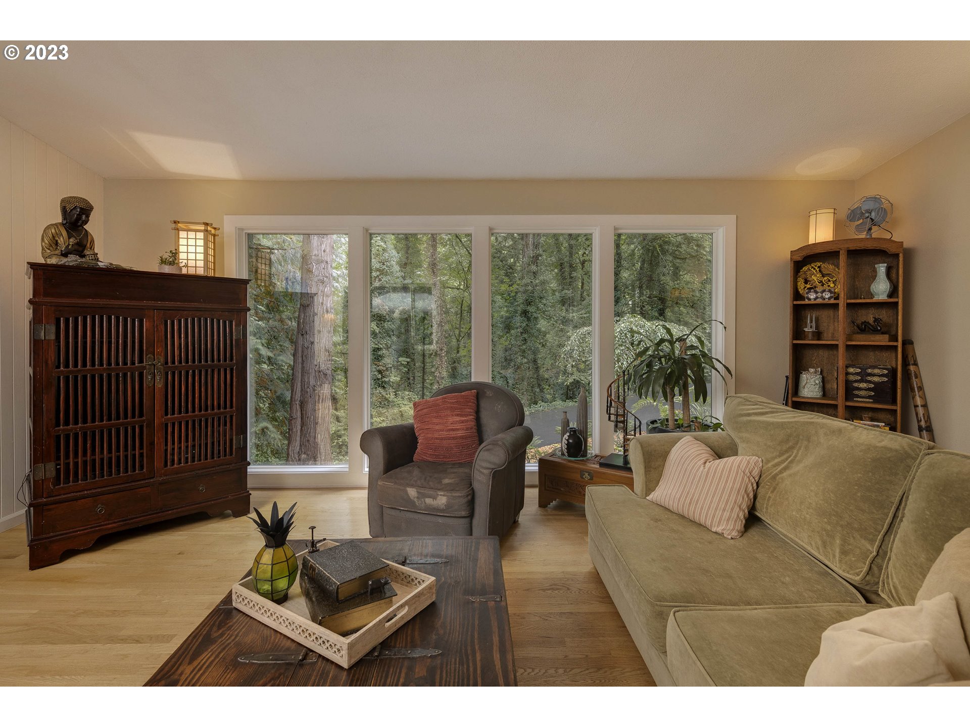 9732 Southwest 18th Place Portland, OR 97219 - Photo 12 of 45 a living room with furniture and a floor to ceiling window