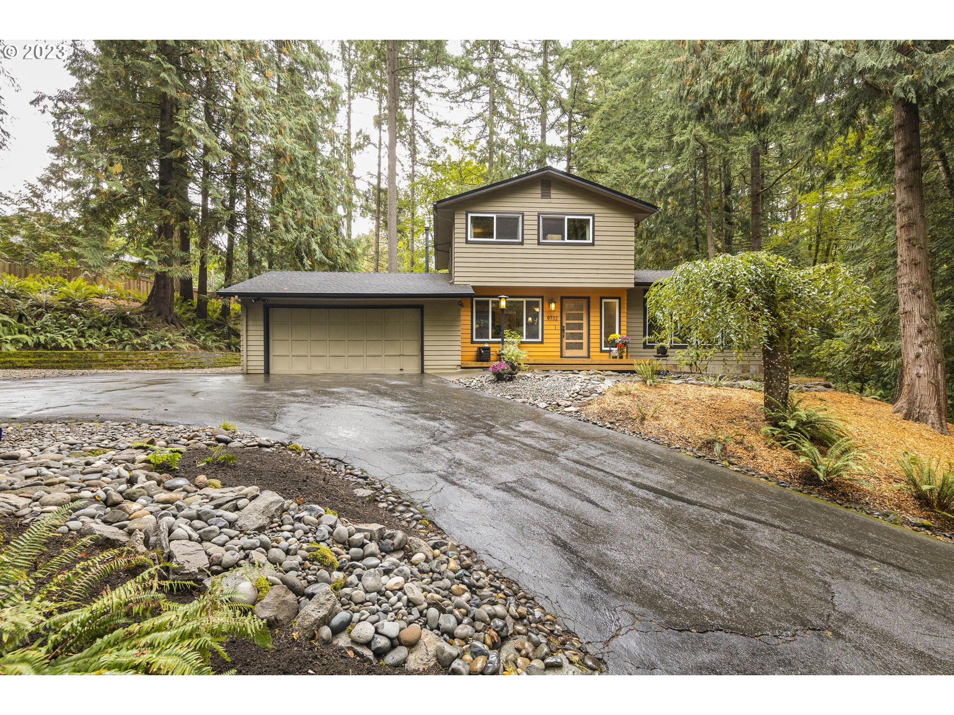 9732 Southwest 18th Place Portland, OR 97219 - Photo 2 of 45 a front view of a house with a yard