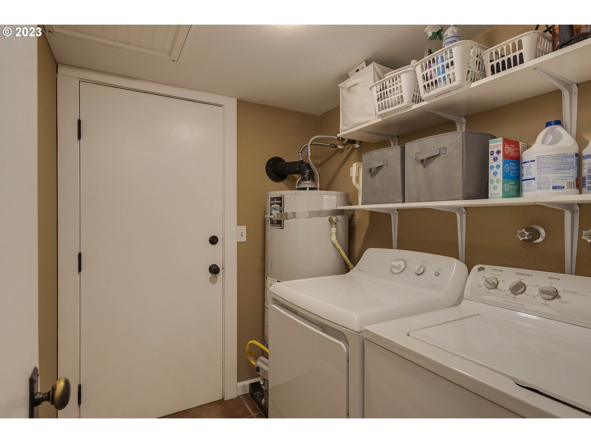 9732 Southwest 18th Place Portland, OR 97219 - Photo 21 of 45 a utility room with dryer and washer