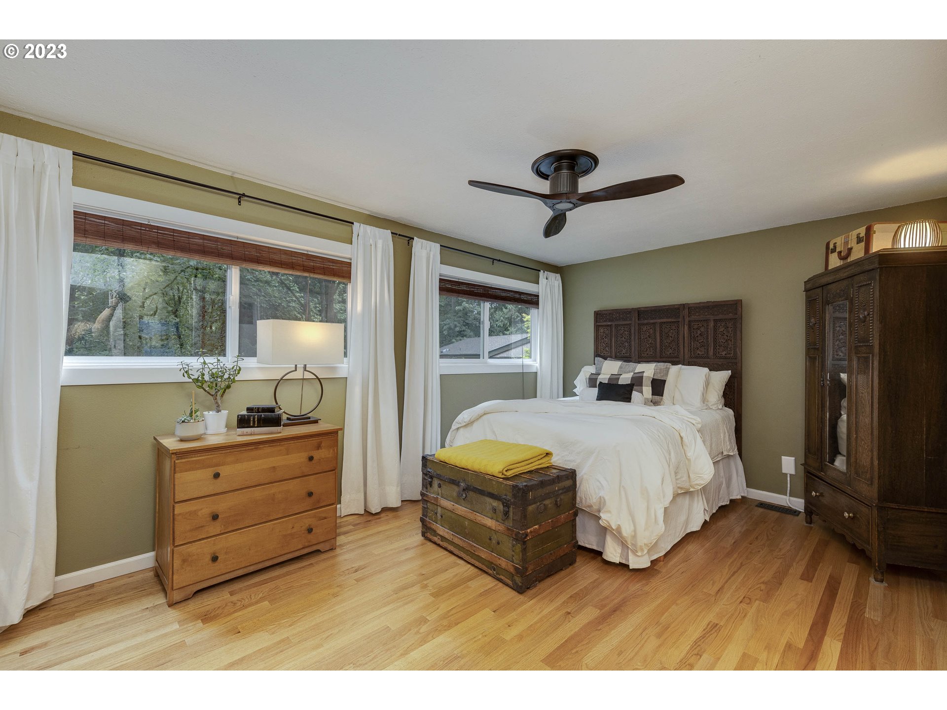 9732 Southwest 18th Place Portland, OR 97219 - Photo 23 of 45 a bedroom with a bed and a large window