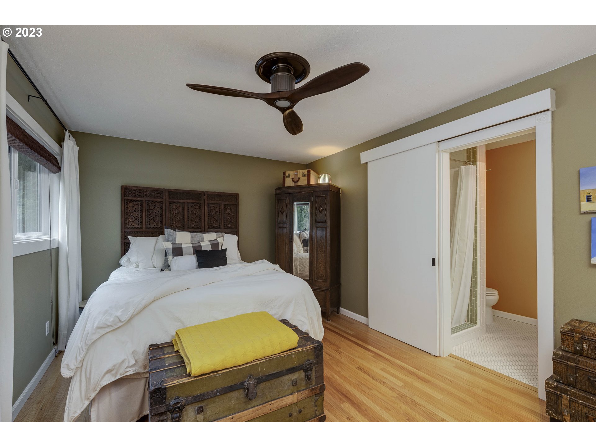 9732 Southwest 18th Place Portland, OR 97219 - Photo 24 of 45 a bedroom with a bed and a view of kitchen