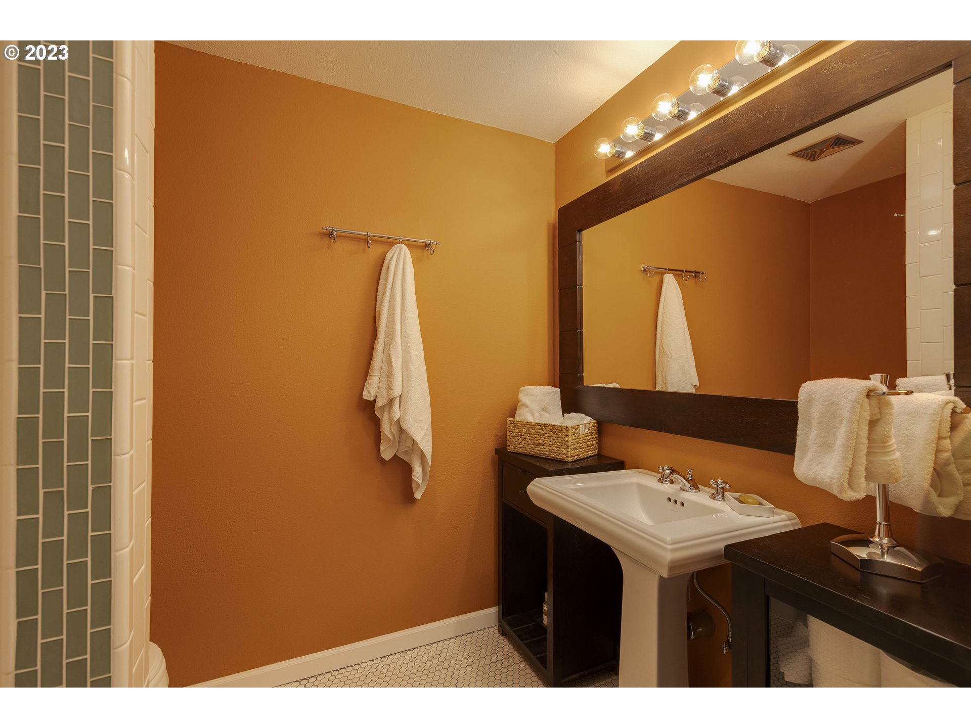 9732 Southwest 18th Place Portland, OR 97219 - Photo 25 of 45 a bathroom with a sink and a mirror